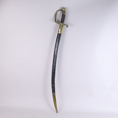 an old sword with a wooden handle on a white background
