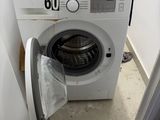 an image of a washing machine in a small room