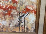 une peinture à l'huile de fleurs rouges dans un cadre doré sur un mur