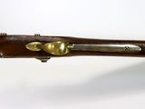 an old wooden rifle with brass fittings on a white background