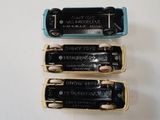 three harmonicas that are sitting on a table