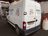 a white van that is parked in a garage