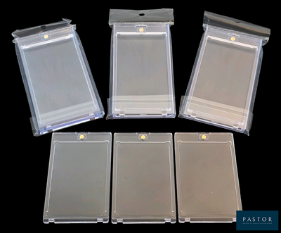 four clear plastic id cards sitting on top of a black surface