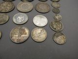 a lot of coins that are on the table