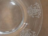 a glass plate with a design on it on a table