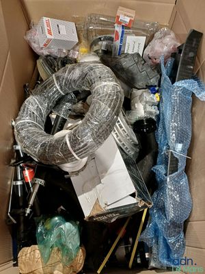 a cardboard box full of assorted items in it