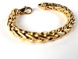 an image of a gold bracelet on a white background