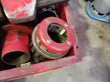 a red tool box filled with tools in a garage