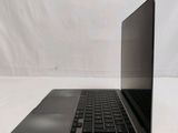 an open laptop computer sitting on top of a white table