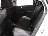 the back seats of a white car with a black seat belt