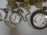 many different types of pocket watches and coins on the table