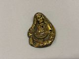 an image of a gold plated figurine of a woman