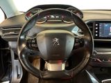 the interior of a car with a steering wheel and dashboard controls