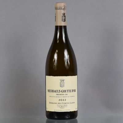 a bottle of wine that is sitting on a table