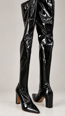 a close up of a pair of black boots on a white background