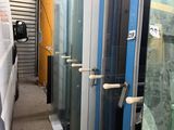 many glass doors that are lined up in a room