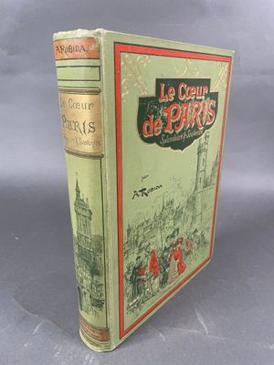 le livre est posé sur une table avec un fond gris