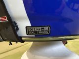 a close up of a motorcycle helmet with a sticker on it
