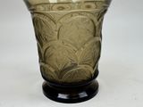 a glass vase that is sitting on a table