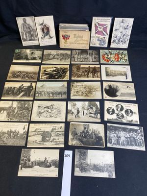 an old photo of a bunch of old postcards on a table