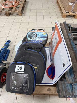 a pile of luggage sitting on a pallet in a warehouse