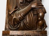 a statue of a woman holding a baby in her arms