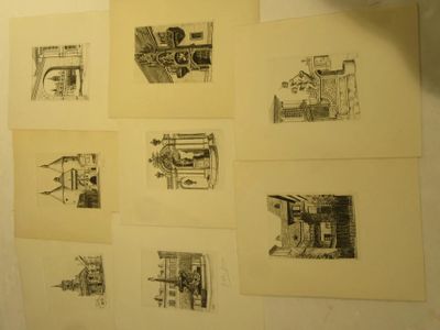 drawings on a wall of a bathroom with a toilet and a sink