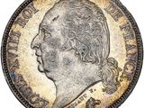 une pièce d'argent représentant la tête d'un homme de profil