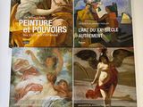 trois livres posés sur une table, à côté d'un tableau représentant une femme et d'un autre représentant un homme