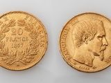 two gold sovereigns, one of which has a head of a man and the other of a woman
