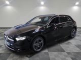 a black mercedes cla parked on a checkered floor