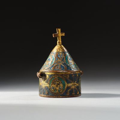 an image of a blue and gold covered box with a cross on top