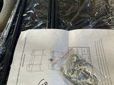a piece of paper on a table with a bunch of screws