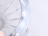 a person holding a plastic object in their hand