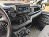 the interior of a car with a steering control and dashboard controls