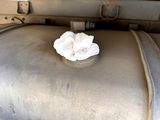 a piece of paper sitting on top of a piece of luggage