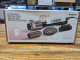 a box of hair brushes on a table in a store