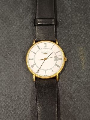 an image of a close up of a wrist watch on a table