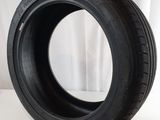 a close up of a tire on a white surface