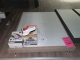 a coffee table with a vacuum on top of it