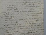 an old document with writing on it sitting on top of a table