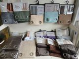 many different types of bedding on display in a store