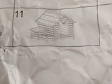 a piece of paper that has a drawing of a house on it