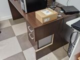 a desk with a computer and a monitor on it
