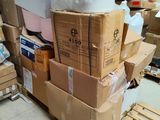 many boxes stacked on top of each other in a warehouse