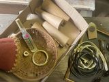 a box with a pair of scissors and other items in it