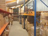 many boxes on the shelves in the warehouse