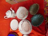 a lot of dishes and cups on the table