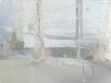a blurry photo of a window with a tennis racket in it