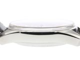 a close up of a watch on a white surface with a white background